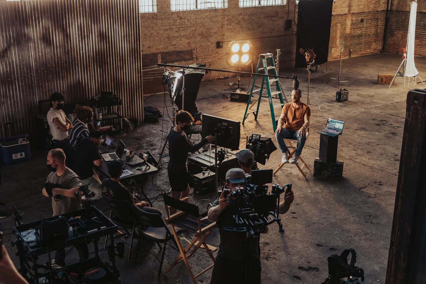 A film crew gathered around a camera setup